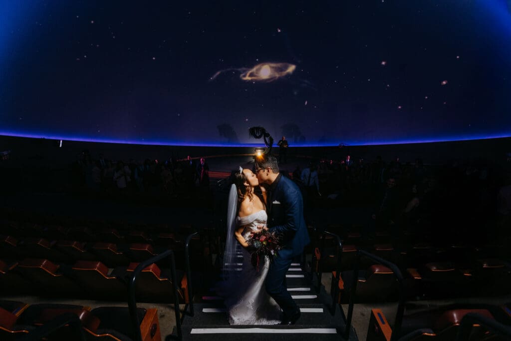 Bride and Groom Kissing at Chabot Space and Science Center on Wedding Day
