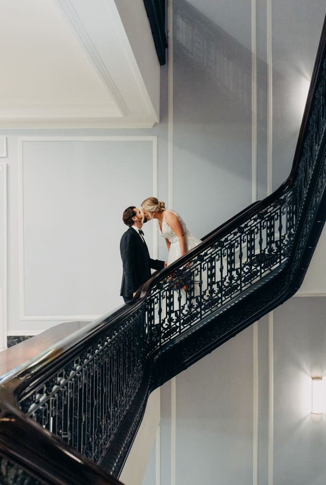 Bride and groom first look on the staircase at the Palace Hotel San Francisco