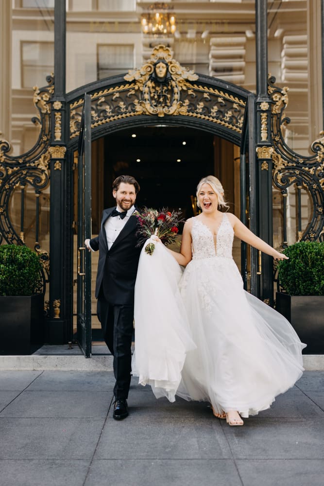 Wedding portrait in front of the historic Palace Hotel San Francisco entrance