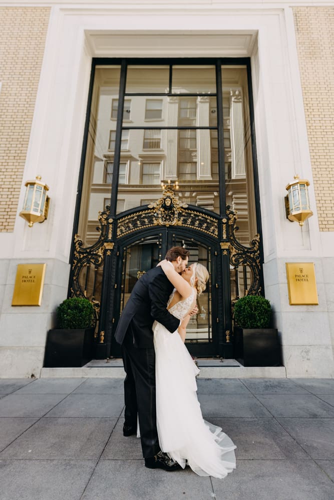 Wedding portrait in front of the historic Palace Hotel San Francisco entrance