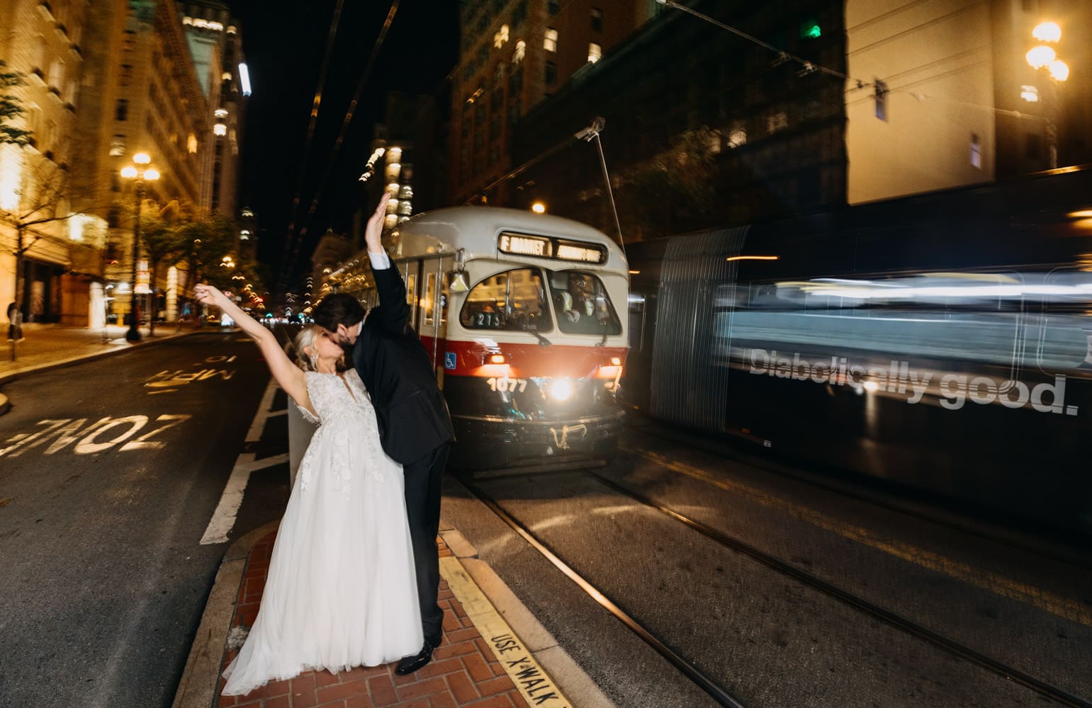Couple portrait outside the Palace Hotel San Francisco on Market Street Cable Cars Trolley
