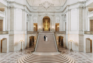 wide shot San Francisco City Hall grand staircase wedding photo