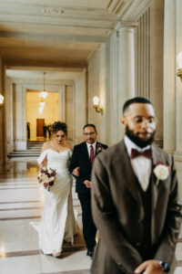 first look at tall window stone floor San Francisco City Hall wedding