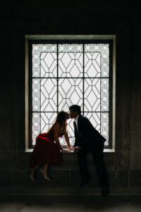 couple seated in third floor window San Francisco City Hall