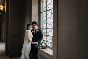 couple seated in third floor window San Francisco City Hall