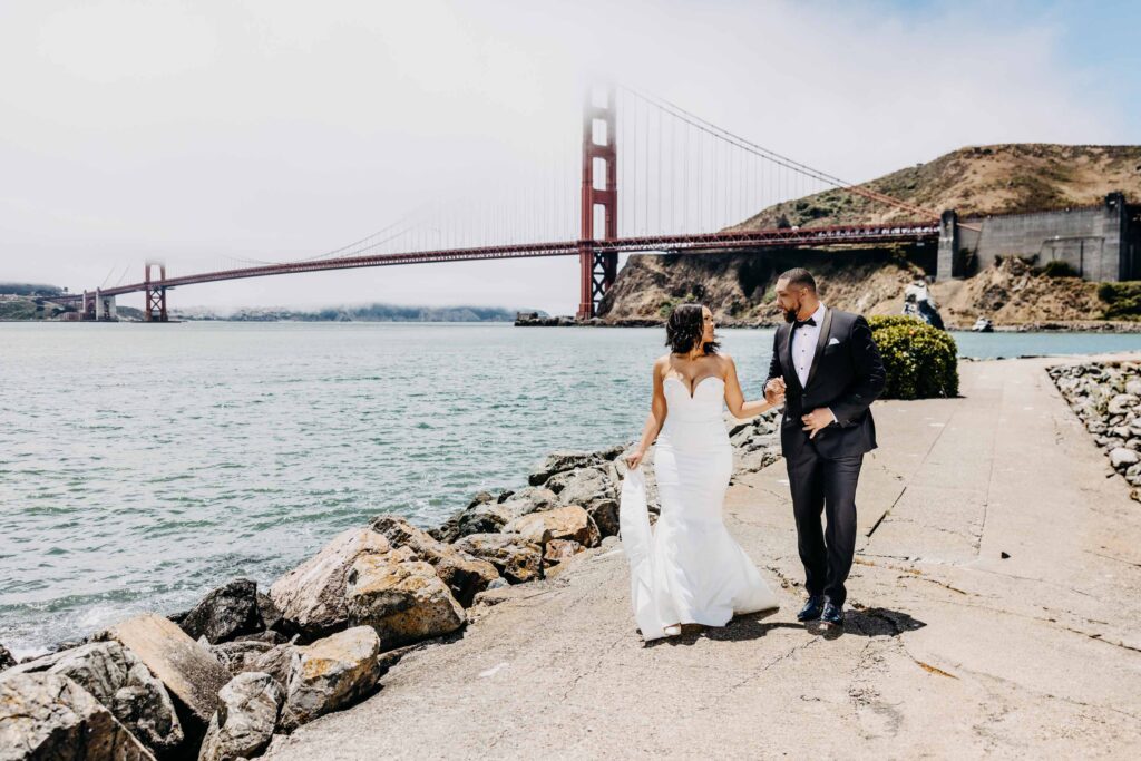 Black couple at Golden Gate bridge after their San Francisco City Hall wedding ceremony