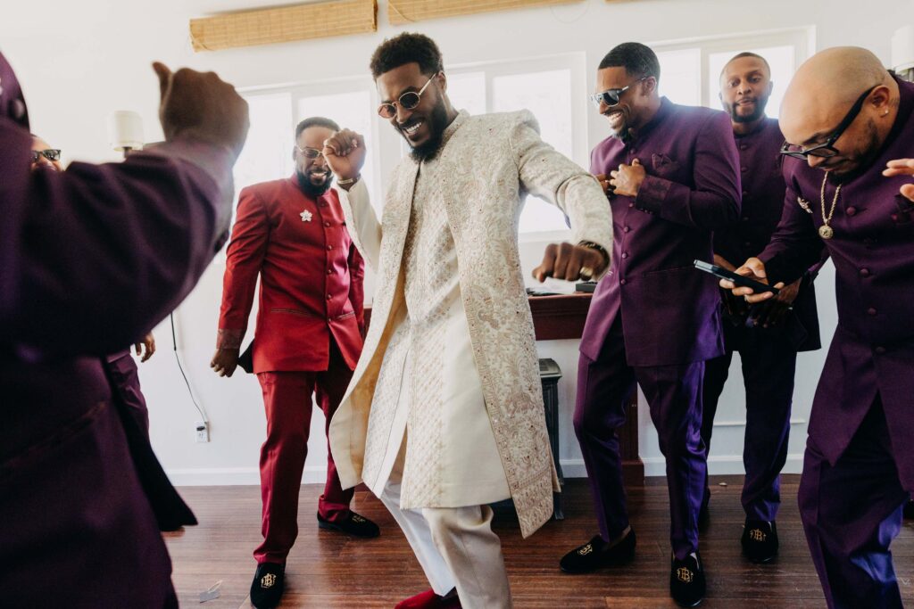Groom and groomsmen dancing during getting ready at Lavanda at Leal Vineyards