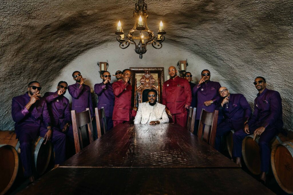Black Groom's formal portraits shot in a moody cave setting at Lavanda at Leal Vineyards