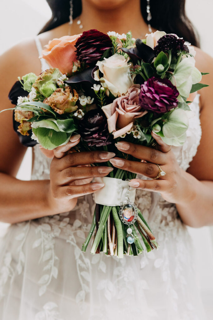 Bride bouquet with mother's picture in it.