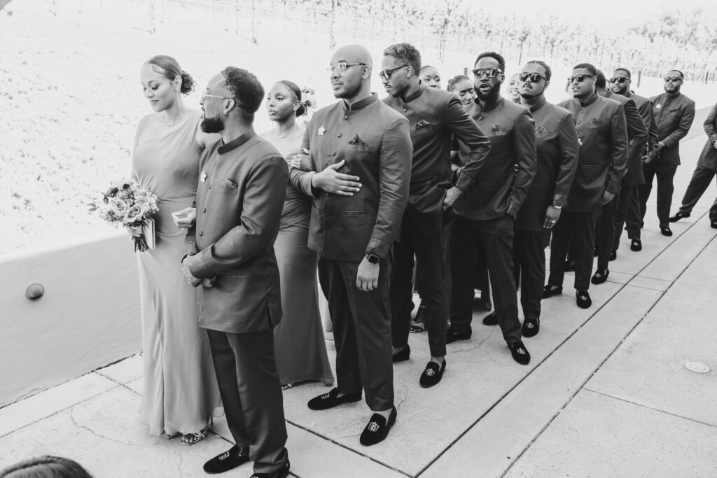Wedding party lines up before the ceremony begins at Lavanda Leal Vineyards