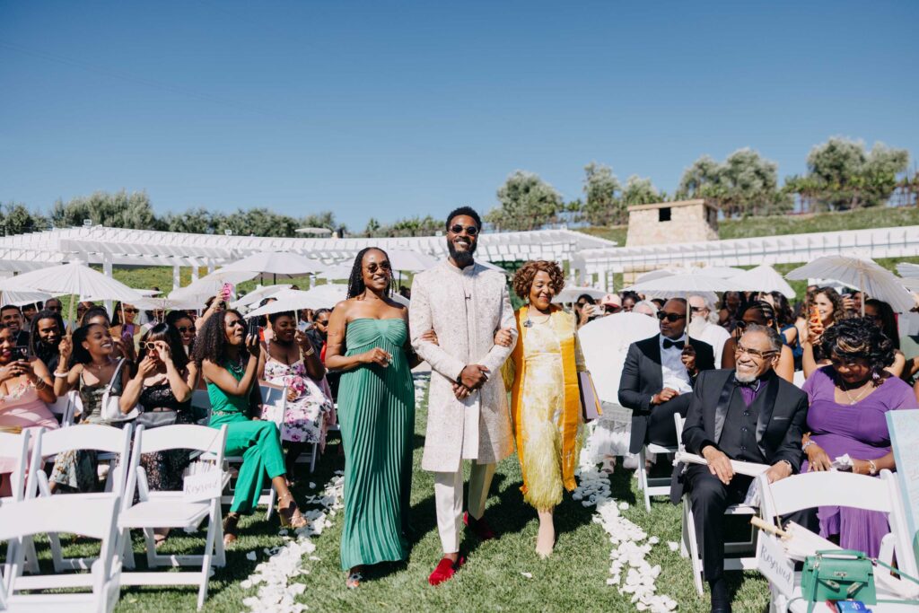 Black groom walking down the aisle at Lavanda Leal Vineyards