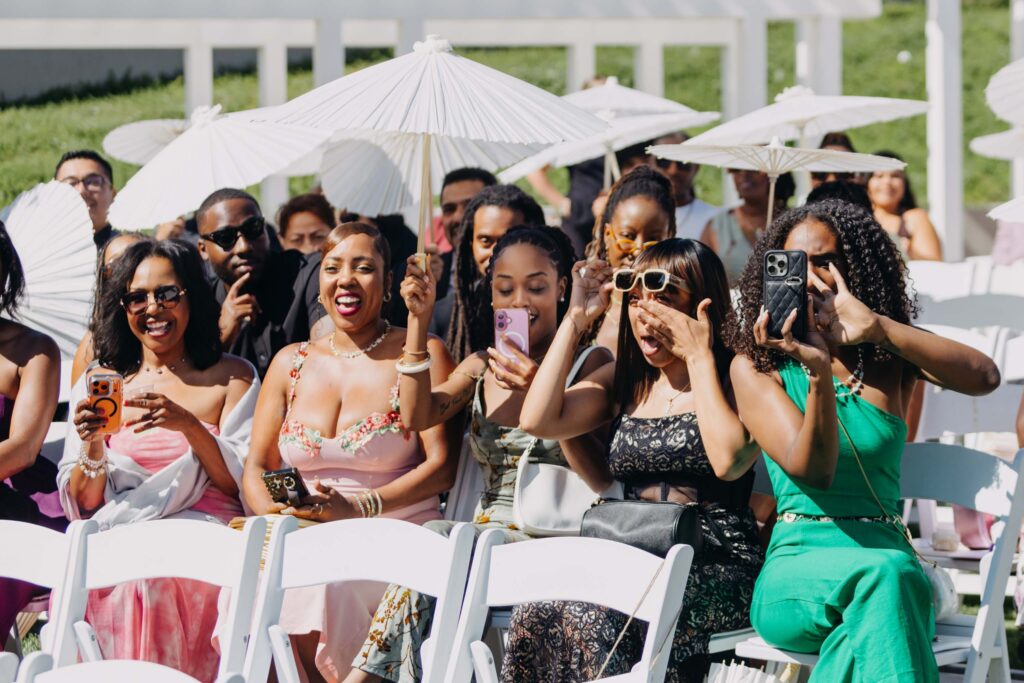 Guests clapping as groom walks down the aisle at Lavanda Leal Vineyards