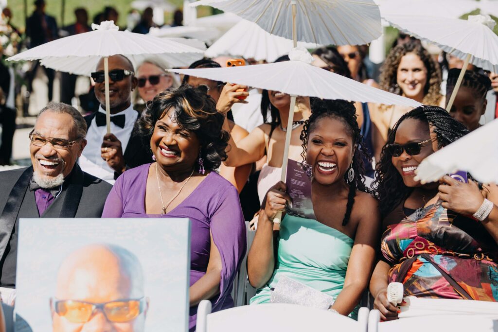 Guests clapping as groom walks down the aisle at Lavanda Leal Vineyards