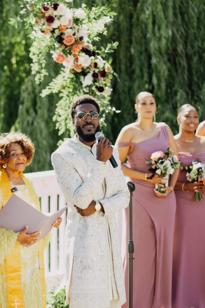 Black groom singing to his bride as she walks down the aisle at Lavanda Leal Vineyards