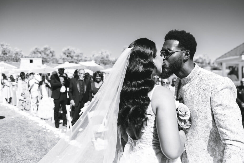 Black groom greeting his bride after she walked down the aisle.