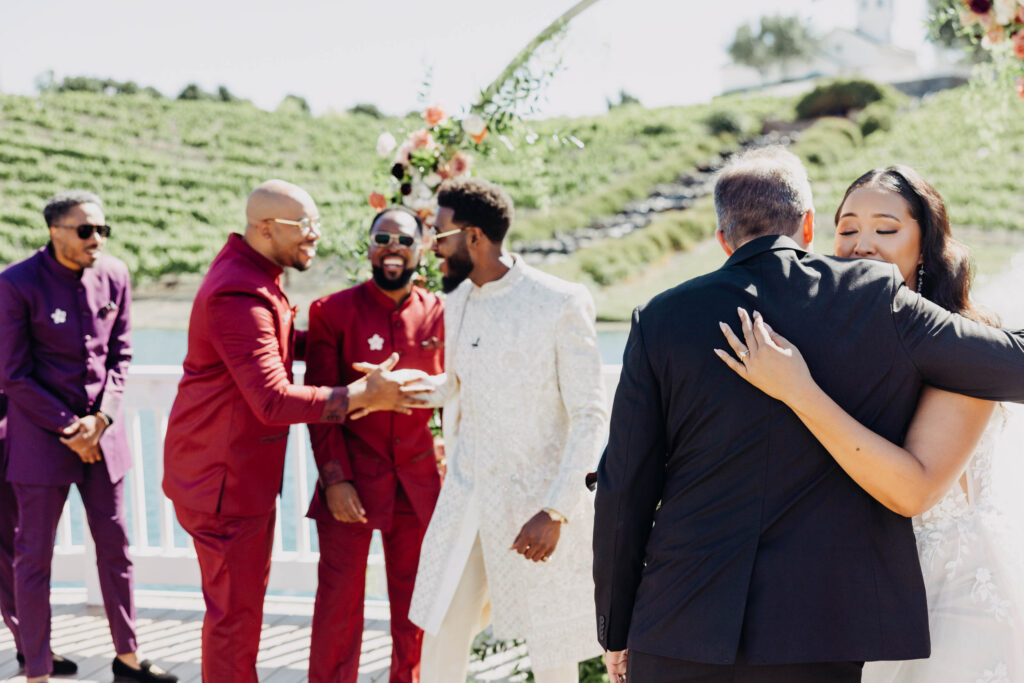 Black groom greeting his bride after she walked down the aisle.