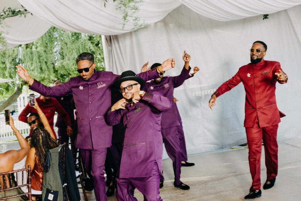 Wedding guests cheering as wedding party makes their reception entrance at Lavanda Leal Vineyards.