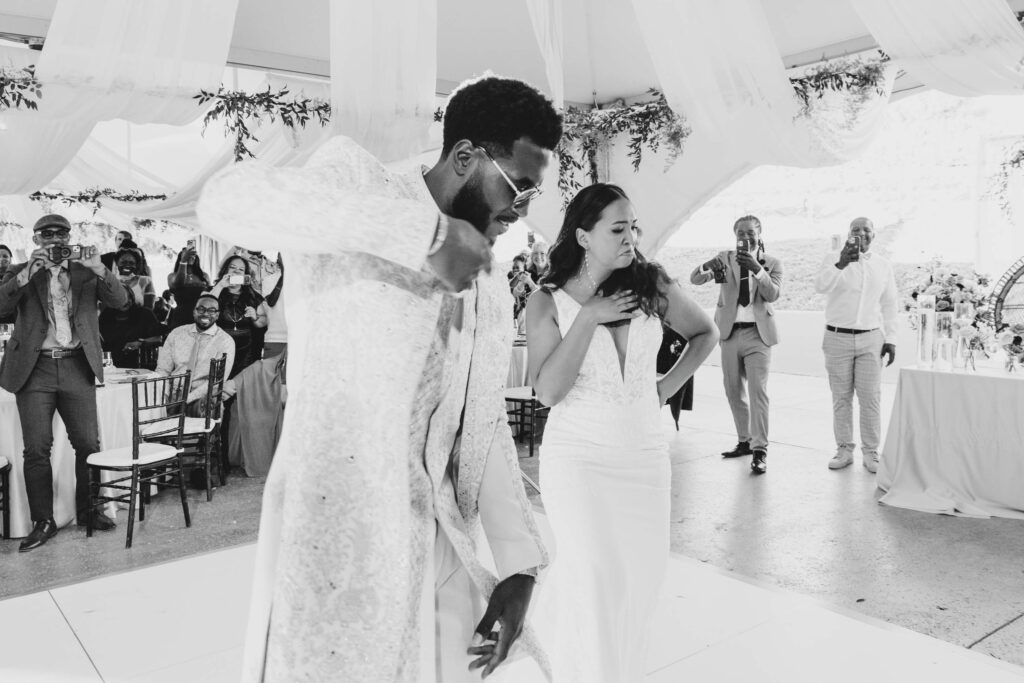 Wedding guests cheering as the newlywed Black couple makes their reception entrance at Lavanda Leal Vineyards.