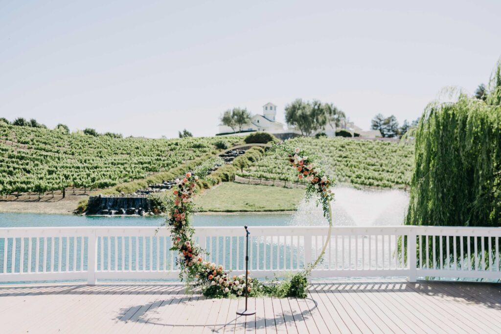 Ceremony arch set up among the vines at Lavanda Leal Vineyards before guests arrive.