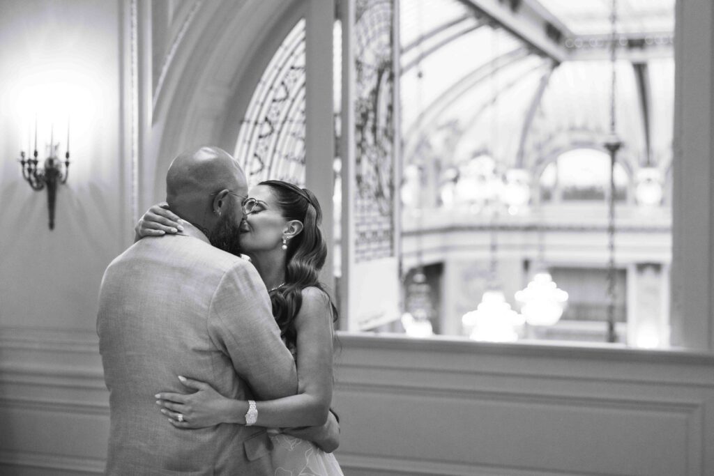 A bride and groom having their first dance in the French Parlor of the Palace Hotel